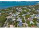 Scenic aerial view of a residential community surrounded by lush greenery and waterfront at 217 Manatee Rd, Belleair, FL 33756