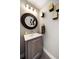 This bathroom features a modern vanity, stylish mirror, and unique wall decorations, offering a sleek and contemporary design at 217 Manatee Rd, Belleair, FL 33756