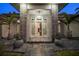 Eye-catching front entrance with stone accents, stylish lighting, and decorative potted greenery at 217 Manatee Rd, Belleair, FL 33756