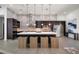 Gourmet kitchen featuring an oversized island, high-end appliances, and custom cabinetry at 217 Manatee Rd, Belleair, FL 33756