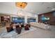 Open-concept living and dining space with floor-to-ceiling windows offering a great view at 217 Manatee Rd, Belleair, FL 33756