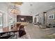 Open living area with decorative lighting, modern furnishings, and a stylish fireplace at 217 Manatee Rd, Belleair, FL 33756