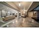 Expansive open-concept living area with fireplace and seamless flow to dining and kitchen spaces and outdoor living at 217 Manatee Rd, Belleair, FL 33756