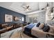 Spacious main bedroom features a tray ceiling, backyard views, and a cozy sitting area with stylish decor at 217 Manatee Rd, Belleair, FL 33756