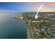 Aerial view showcasing the property's location near the bay and surrounding neighborhood at 235 Aberdeen St, Dunedin, FL 34698