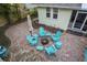 Cozy backyard patio with Adirondack chairs around a fire pit for outdoor gatherings at 235 Aberdeen St, Dunedin, FL 34698
