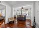 Stylish bar area with seating, windows, and hardwood floors creates an inviting space at 235 Aberdeen St, Dunedin, FL 34698