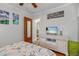 Bedroom with beachy decor and a TV, creating a relaxing retreat at 235 Aberdeen St, Dunedin, FL 34698