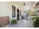 Cozy front porch featuring a seating area and decor, creating a welcoming entrance at 235 Aberdeen St, Dunedin, FL 34698