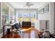 Office with hardwood floors, natural light, modern desk, and plenty of storage at 235 Aberdeen St, Dunedin, FL 34698