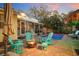 Backyard pool with a screened porch, fire pit, and lounge furniture, ideal for outdoor living and entertaining at 235 Aberdeen St, Dunedin, FL 34698