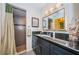 Bathroom features a dark vanity, shower, and contemporary finishes at 2749 Countryside Blvd # 28, Clearwater, FL 33761