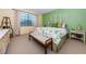 Bright bedroom featuring a bench, plush carpet and soft, natural light at 2749 Countryside Blvd # 28, Clearwater, FL 33761