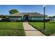 Inviting clubhouse exterior with manicured landscaping and well-maintained facade at 2749 Countryside Blvd # 28, Clearwater, FL 33761