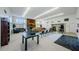 Spacious clubhouse featuring a fireplace, kitchen, and versatile seating areas at 2749 Countryside Blvd # 28, Clearwater, FL 33761