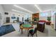 Open-concept clubhouse with fireplace, tables, chairs, and ample seating for gatherings and community events at 2749 Countryside Blvd # 28, Clearwater, FL 33761