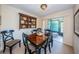 Elegant dining room with traditional decor, a decorative shelf, and access to the patio at 2749 Countryside Blvd # 28, Clearwater, FL 33761