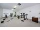 Home exercise room with various workout machines and fitness equipment to support a healthy lifestyle at 2749 Countryside Blvd # 28, Clearwater, FL 33761
