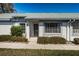 Charming villa with manicured landscaping and inviting entryway at 2749 Countryside Blvd # 28, Clearwater, FL 33761