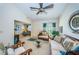 Inviting living room featuring a ceiling fan and seamless layout at 2749 Countryside Blvd # 28, Clearwater, FL 33761