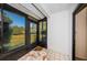 Enclosed patio space with views of the lush landscaping and backyard at 2749 Countryside Blvd # 28, Clearwater, FL 33761