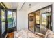 Enclosed patio offers a relaxing view of the backyard and nearby rooms at 2749 Countryside Blvd # 28, Clearwater, FL 33761
