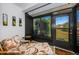 Enclosed patio features a daybed, tile flooring, and views of the backyard at 2749 Countryside Blvd # 28, Clearwater, FL 33761