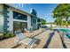 Inviting community pool area with comfortable lounge chairs for relaxation and enjoyment under the sun at 2749 Countryside Blvd # 28, Clearwater, FL 33761