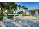 Relaxing pool area featuring lounge chairs, lush landscaping, and a serene atmosphere for residents to unwind at 2749 Countryside Blvd # 28, Clearwater, FL 33761