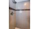 Tile shower features a contemporary design with updated fixtures at 2749 Countryside Blvd # 28, Clearwater, FL 33761