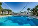 Sparkling community swimming pool surrounded by well-maintained landscaping and comfortable seating at 2749 Countryside Blvd # 28, Clearwater, FL 33761