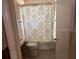 Bathroom featuring a toilet and shower with decorative curtain at 3001 57Th S St, Gulfport, FL 33707