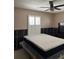 Bedroom featuring a fan, window with white blinds and a mattress on a bed frame at 3001 57Th S St, Gulfport, FL 33707