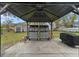 View of an outdoor patio area under a gazebo featuring large tool chests at 301 Shore E Dr, Oldsmar, FL 34677