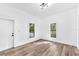 Bright living room featuring hardwood floors, neutral walls, and natural light for a cozy and inviting atmosphere at 3201 E 23Rd Ave, Tampa, FL 33605