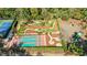 Beautiful aerial view of the community shuffleboard, putt putt, and playground areas at 36750 Us Highway 19 N # 3-210, Palm Harbor, FL 34684