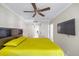 Spacious bedroom showcasing modern furniture, ceiling fan, and tile floors at 36750 Us Highway 19 N # 3-210, Palm Harbor, FL 34684