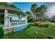 Community sign for Innisbrook Resort and Golf Club with well-maintained landscaping at 36750 Us Highway 19 N # 3-210, Palm Harbor, FL 34684