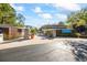 Inviting entrance to Loch Ness community, featuring stone accents and lush landscaping on a beautiful sunny day at 36750 Us Highway 19 N # 3-210, Palm Harbor, FL 34684