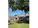 Brick condo building featuring a unique roofline and lush landscaping, inviting you to your new home at 36750 Us Highway 19 N # 3-210, Palm Harbor, FL 34684
