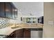 Well-appointed kitchen featuring granite counters and stainless steel dishwasher with a view of the outdoors at 36750 Us Highway 19 N # 3-210, Palm Harbor, FL 34684