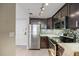 Updated kitchen with stainless steel appliances, granite counters, and dark wood cabinetry at 36750 Us Highway 19 N # 3-210, Palm Harbor, FL 34684