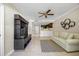 Comfortable living room with modern furnishings, tile floors, and a glimpse of the kitchen at 36750 Us Highway 19 N # 3-210, Palm Harbor, FL 34684