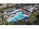 Expansive community pool with lush landscaping and comfortable lounge area at 407 Feltham Trl # A, Sun City Center, FL 33573