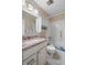 Bathroom featuring granite countertops and updated fixtures at 407 Feltham Trl # A, Sun City Center, FL 33573