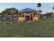 Beautiful gazebo decorated with holiday lights for an outdoor gathering at 407 Feltham Trl # A, Sun City Center, FL 33573