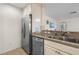 Kitchen featuring stainless steel appliances, granite countertops, and ample counter space at 407 Feltham Trl # A, Sun City Center, FL 33573
