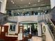 Elegant lobby with grand staircase and comfortable seating area for residents at 407 Feltham Trl # A, Sun City Center, FL 33573