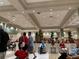 Elegant lobby area with comfortable seating and a festive holiday tree at 407 Feltham Trl # A, Sun City Center, FL 33573