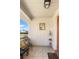 Inviting front porch featuring tiled flooring, neutral paint, and space for seating to enjoy the neighborhood view at 407 Feltham Trl # A, Sun City Center, FL 33573